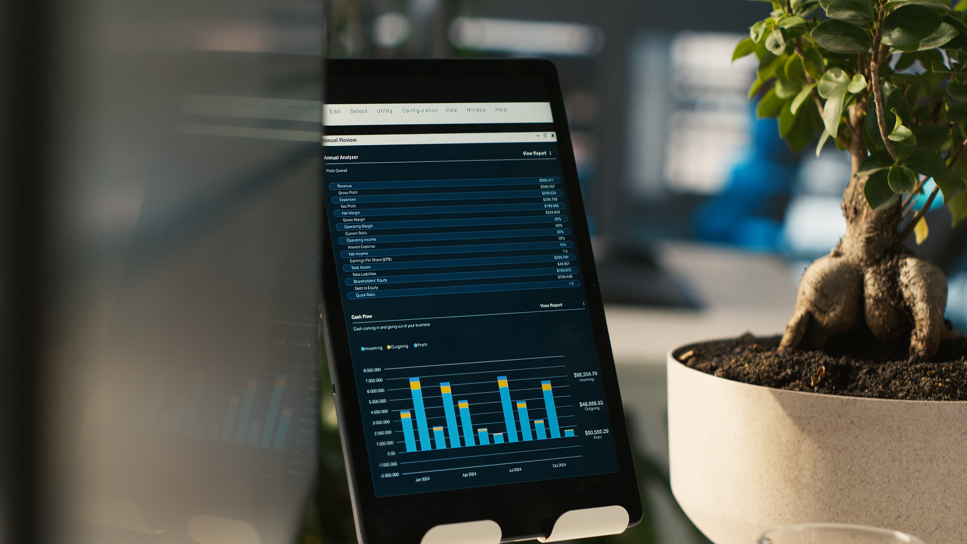 A tablet showing a client income statement.